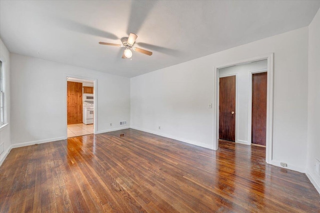 1113 Brandon Ave SW, Roanoke, VA 24015 - spare room featuring a ceiling fan, hardwood / wood-style floors, and baseboards