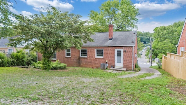 1113 Brandon Ave SW, Roanoke, VA 24015 - rear view of house with brick siding, central AC unit, and a chimney