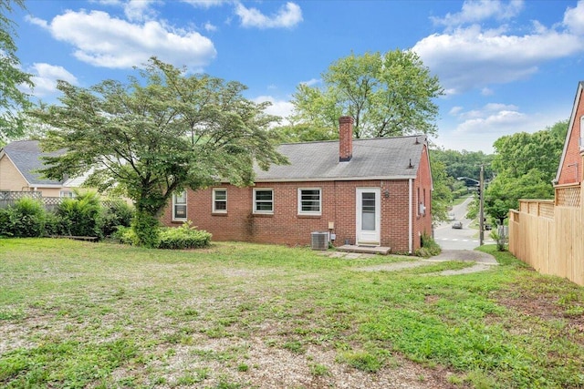1113 Brandon Ave SW, Roanoke, VA 24015 - rear view of house featuring brick siding, entry steps, a chimney, and cooling unit