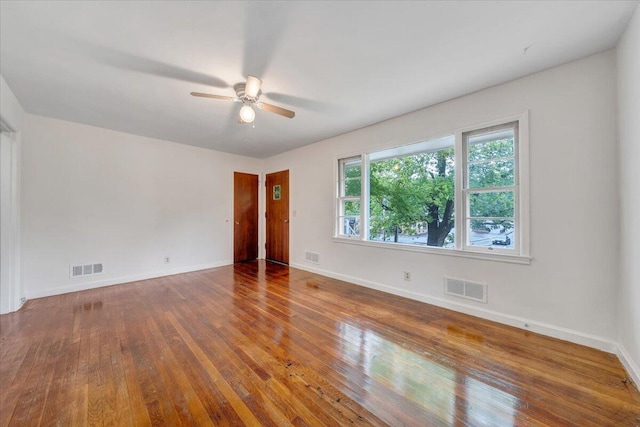 1113 Brandon Ave SW, Roanoke, VA 24015 - unfurnished room featuring hardwood / wood-style flooring, a ceiling fan, and baseboards