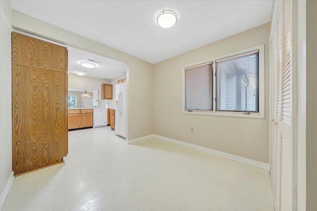 8506 Pine Hurst Cir, Roanoke, VA 24019 - unfurnished living room with baseboards, light flooring, and a sink