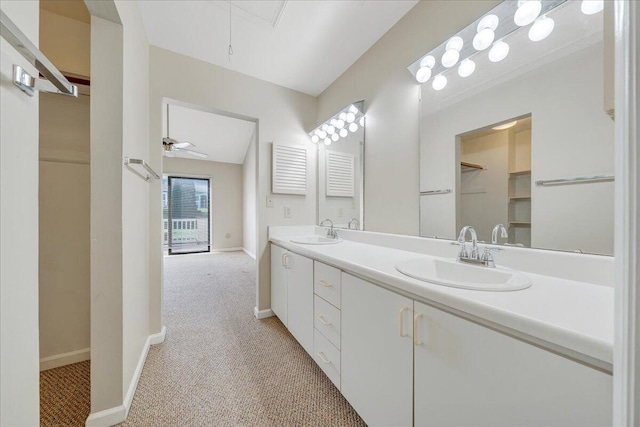 8506 Pine Hurst Cir, Roanoke, VA 24019 - bathroom with double vanity, baseboards, a walk in closet, and a ceiling fan