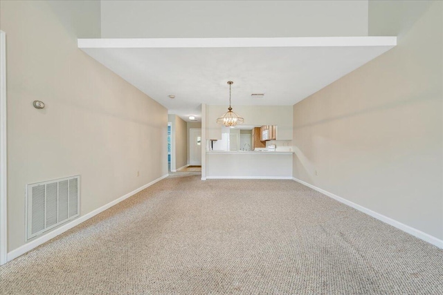 8506 Pine Hurst Cir, Roanoke, VA 24019 - unfurnished living room with light colored carpet, baseboards, and a chandelier