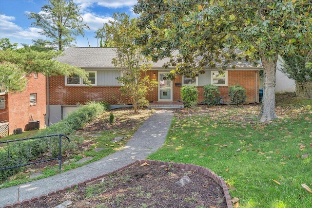 547 Dillard Rd SW, Roanoke, VA 24014 - view of front facade with a front lawn, brick siding, central AC unit, and roof with shingles