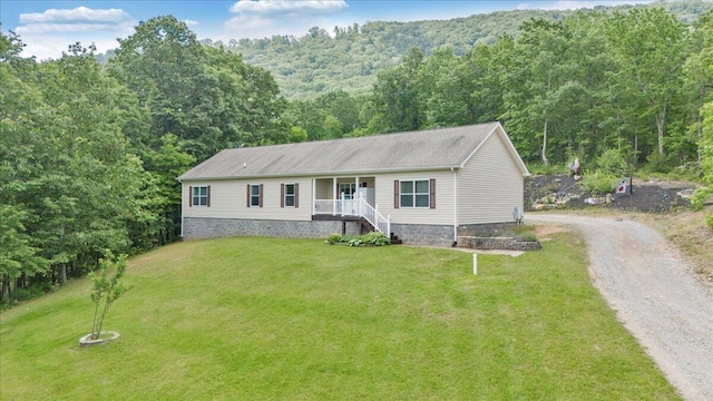 384 White Oak Ln, New Castle, VA 24127 - view of front of home with covered porch, a forest view, a front yard, and driveway