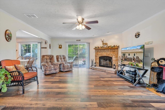 384 White Oak Ln, New Castle, VA 24127 - living room with a textured ceiling, ceiling fan, wood finished floors, plenty of natural light, and ornamental molding