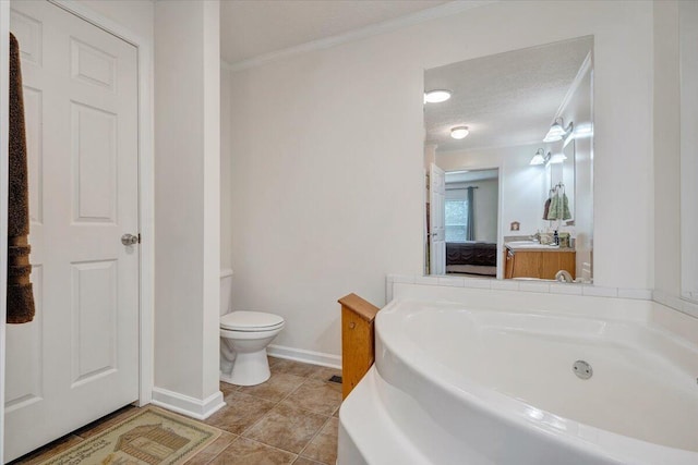 384 White Oak Ln, New Castle, VA 24127 - bathroom with a garden tub, baseboards, ornamental molding, toilet, and tile patterned floors