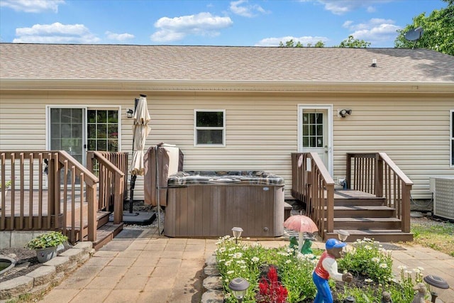 384 White Oak Ln, New Castle, VA 24127 - rear view of property with a shingled roof, central air condition unit, a hot tub, and a deck