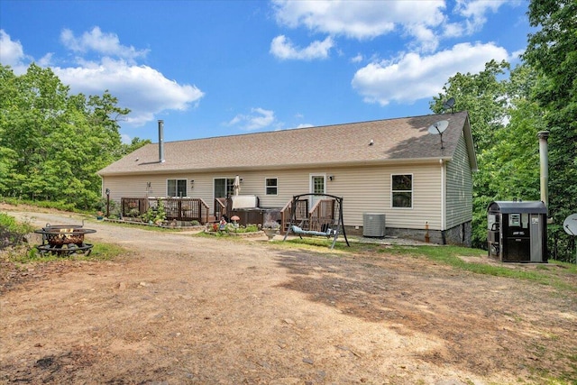384 White Oak Ln, New Castle, VA 24127 - back of house featuring a fire pit, a deck, cooling unit, and roof with shingles