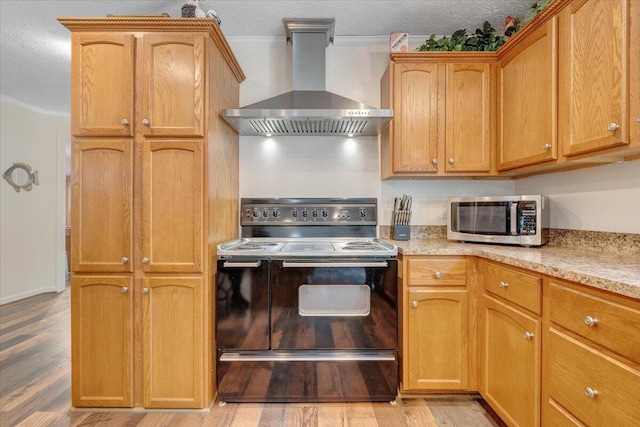 384 White Oak Ln, New Castle, VA 24127 - kitchen with black electric range, wall chimney exhaust hood, stainless steel microwave, ornamental molding, and light wood-style floors