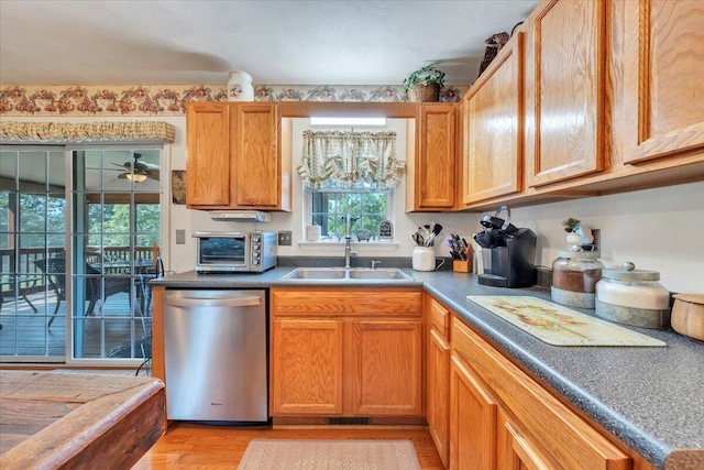 6119 Carolina Trl, Roanoke, VA 24019 - kitchen featuring dishwasher, a sink, and light wood-style flooring