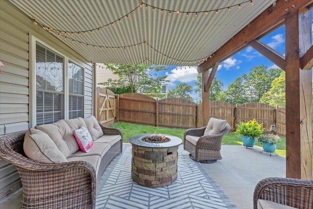 6119 Carolina Trl, Roanoke, VA 24019 - fenced backyard featuring an outdoor living space with a fire pit and a patio area