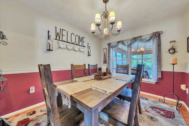 6119 Carolina Trl, Roanoke, VA 24019 - dining room featuring a chandelier, wood finished floors, and baseboards