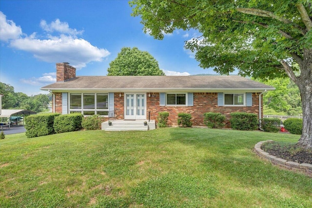 1207 Laymantown Rd, Troutville, VA 24175 - single story home with a chimney, brick siding, a front lawn, french doors, and a carport