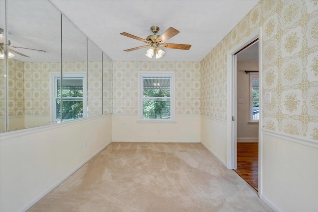 1207 Laymantown Rd, Troutville, VA 24175 - unfurnished room with a ceiling fan, plenty of natural light, wallpapered walls, and carpet