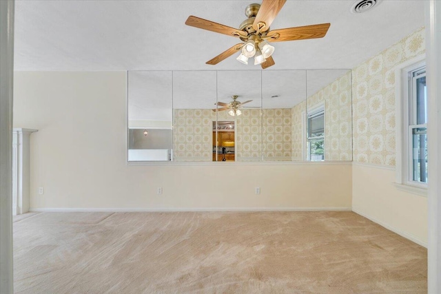 1207 Laymantown Rd, Troutville, VA 24175 - spare room with a ceiling fan, carpet flooring, wallpapered walls, and baseboards