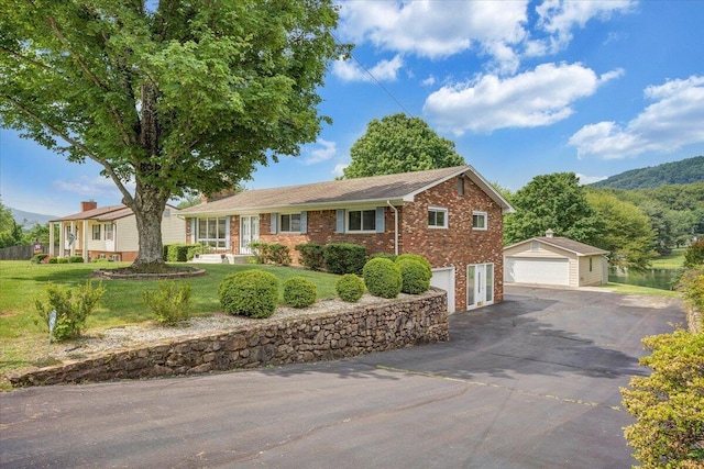 1207 Laymantown Rd, Troutville, VA 24175 - single story home featuring brick siding, a front lawn, an outbuilding, and a garage