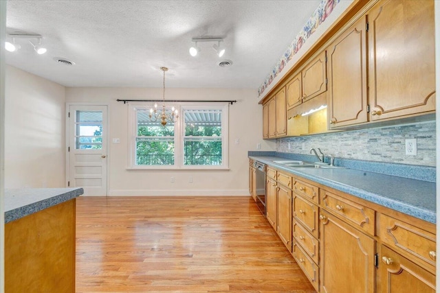 1207 Laymantown Rd, Troutville, VA 24175 - kitchen with a sink, dishwasher, light wood-style floors, a textured ceiling, and a chandelier