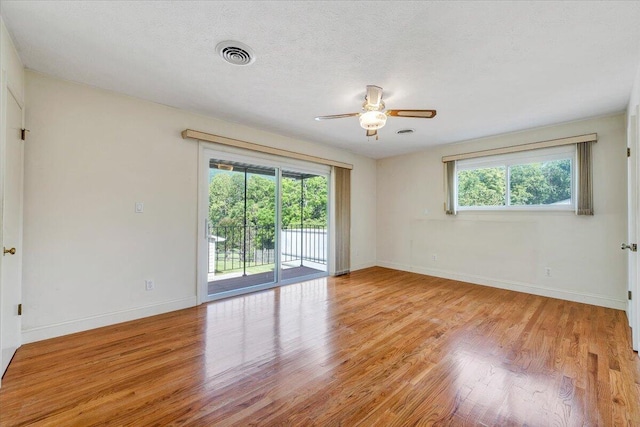 1207 Laymantown Rd, Troutville, VA 24175 - spare room featuring a ceiling fan, baseboards, light wood finished floors, and a textured ceiling