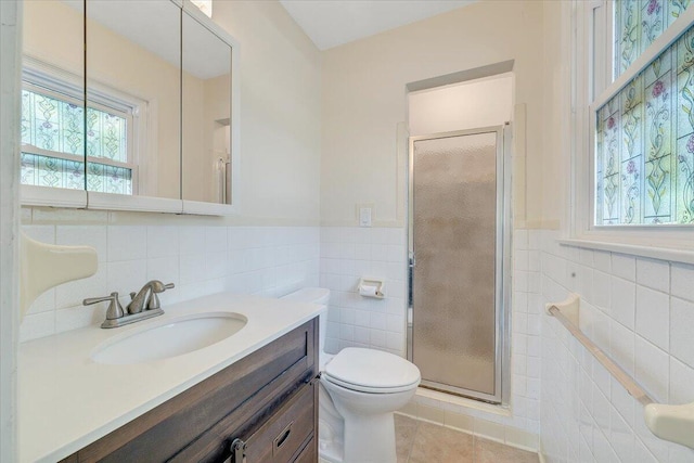1207 Laymantown Rd, Troutville, VA 24175 - full bathroom with tile walls, a stall shower, tile patterned flooring, vanity, and toilet