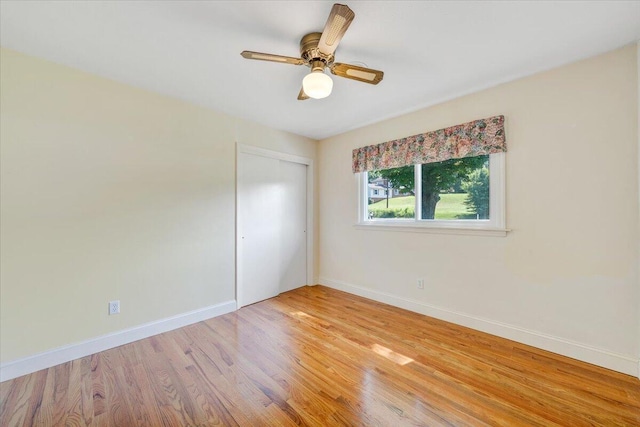 1207 Laymantown Rd, Troutville, VA 24175 - unfurnished bedroom featuring baseboards, light wood-style floors, a closet, and a ceiling fan