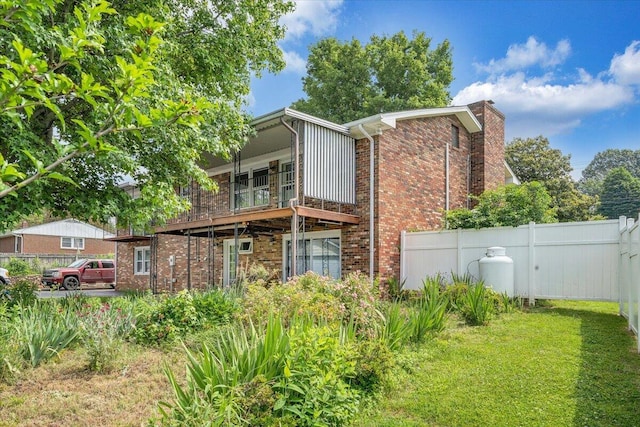 1207 Laymantown Rd, Troutville, VA 24175 - back of property featuring brick siding, a balcony, and a chimney