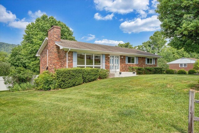 1207 Laymantown Rd, Troutville, VA 24175 - ranch-style house with a chimney, a front yard, and brick siding