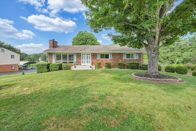 1207 Laymantown Rd, Troutville, VA 24175 - ranch-style home with french doors, a chimney, brick siding, and a front yard