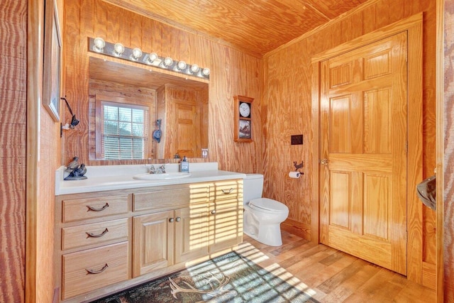 1644 Long Branch Hill Rd, Ferrum, VA 24088 - bathroom with vanity, toilet, wooden walls, wood finished floors, and ornamental molding