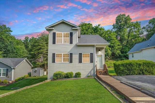 715 N Stonewall St, Salem, VA 24153 - traditional-style home with entry steps, a storage shed, and a lawn