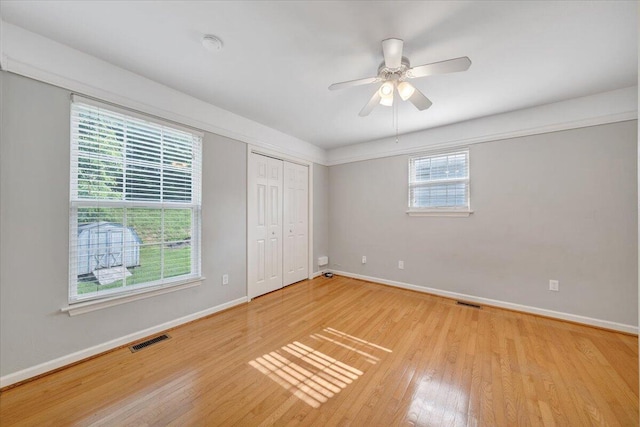 715 N Stonewall St, Salem, VA 24153 - unfurnished bedroom featuring light wood-type flooring, ceiling fan, and a closet