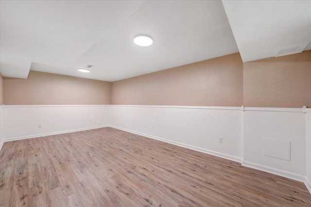 715 N Stonewall St, Salem, VA 24153 - spare room featuring wood finished floors and vaulted ceiling
