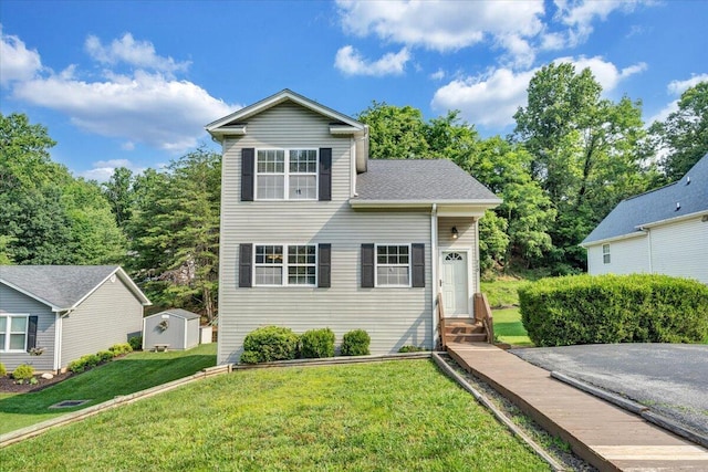 715 N Stonewall St, Salem, VA 24153 - view of front of house featuring entry steps, a front yard, and a storage unit