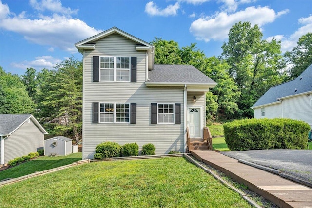 715 N Stonewall St, Salem, VA 24153 - view of front facade featuring entry steps, a storage shed, and a front yard