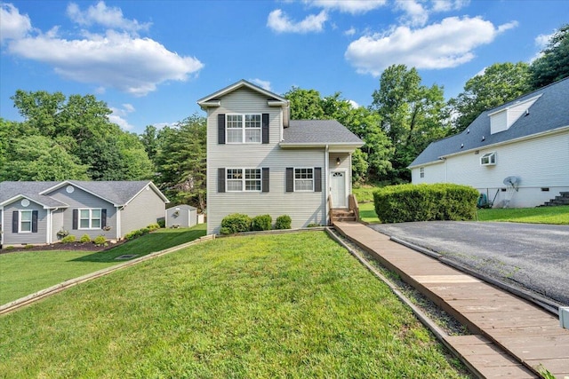 715 N Stonewall St, Salem, VA 24153 - traditional-style house with a front yard, entry steps, and asphalt driveway