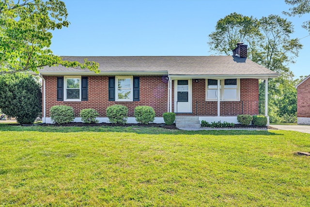 5225 Florist Rd, Roanoke, VA 24019 - view of front of house with a chimney, a front lawn, brick siding, and a shingled roof