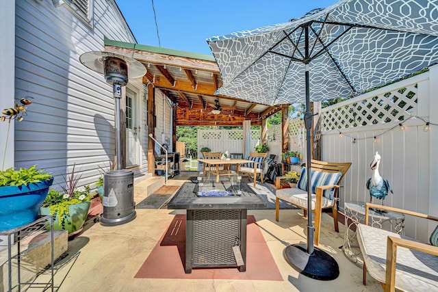 2139 Bailey Ave, Salem, VA 24153 - fenced backyard featuring a ceiling fan, a fire pit, a patio area, and outdoor dining space