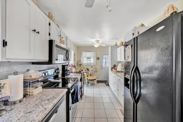 2139 Bailey Ave, Salem, VA 24153 - kitchen with appliances with stainless steel finishes, a ceiling fan, tasteful backsplash, and white cabinetry
