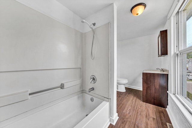 1002 Stewart Ave SE, Roanoke, VA 24013 - bathroom with toilet, vanity, shower / tub combination, wood finished floors, and baseboards