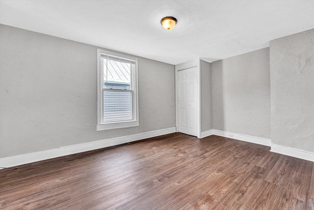 1002 Stewart Ave SE, Roanoke, VA 24013 - spare room with wood finished floors and baseboards