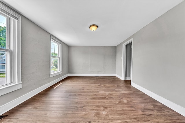 1002 Stewart Ave SE, Roanoke, VA 24013 - empty room featuring wood finished floors and baseboards