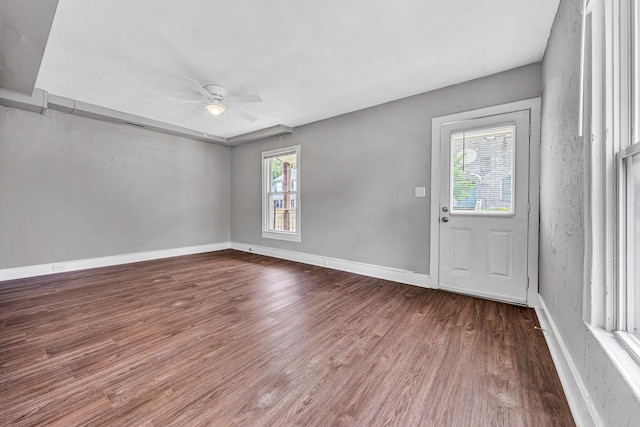 1002 Stewart Ave SE, Roanoke, VA 24013 - spare room with wood finished floors, ceiling fan, and baseboards