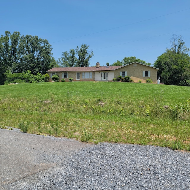 1160 Moorman Rd, Hardy, VA 24101 - view of front facade with a chimney, brick siding, and a front lawn