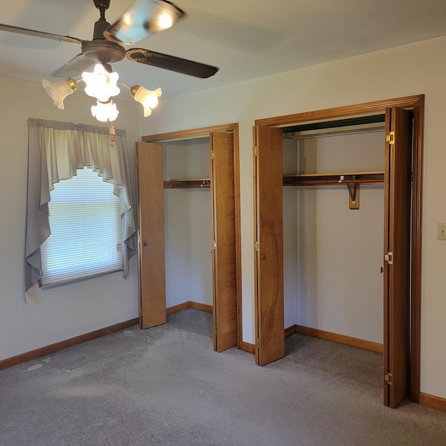 1160 Moorman Rd, Hardy, VA 24101 - unfurnished bedroom with two closets, carpet floors, baseboards, and ceiling fan
