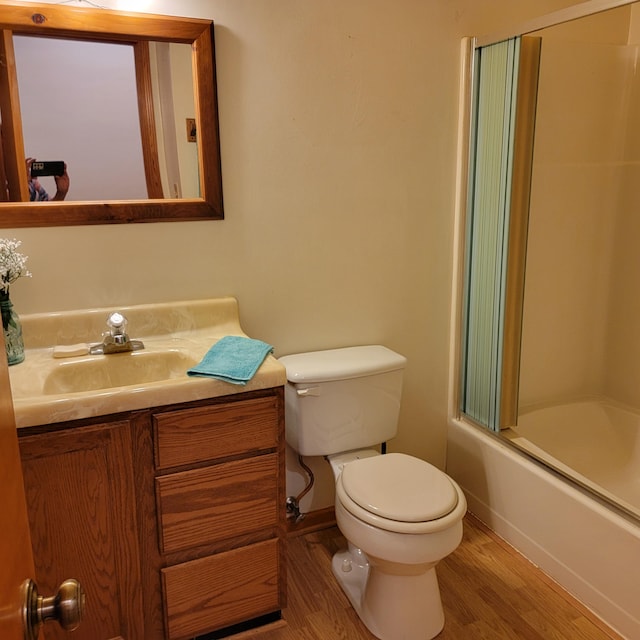 1160 Moorman Rd, Hardy, VA 24101 - full bathroom with toilet, vanity, wood finished floors, combined bath / shower with glass door, and baseboards