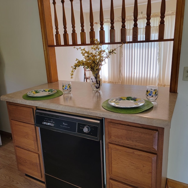 1160 Moorman Rd, Hardy, VA 24101 - kitchen featuring dishwasher, light countertops, and brown cabinetry