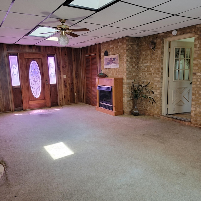 1160 Moorman Rd, Hardy, VA 24101 - foyer entrance featuring a paneled ceiling, carpet flooring, a fireplace, a ceiling fan, and wood walls