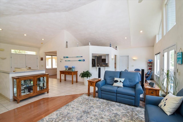 285 Dixon Dr, Hardy, VA 24101 - living room featuring tile patterned flooring, high vaulted ceiling, recessed lighting, and baseboards