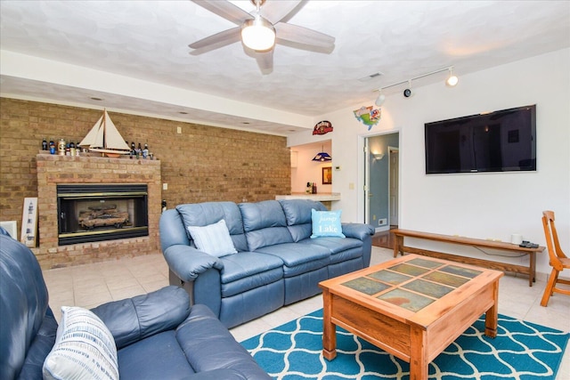 285 Dixon Dr, Hardy, VA 24101 - tiled living area featuring brick wall, ceiling fan, rail lighting, and a brick fireplace