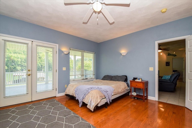 285 Dixon Dr, Hardy, VA 24101 - bedroom featuring access to exterior, wood finished floors, ceiling fan, and baseboards